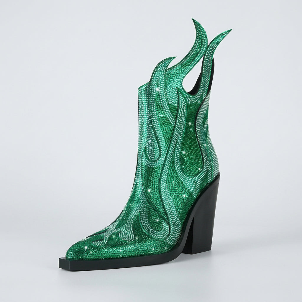 Green cowboy boot with flame design and black heel on a white background